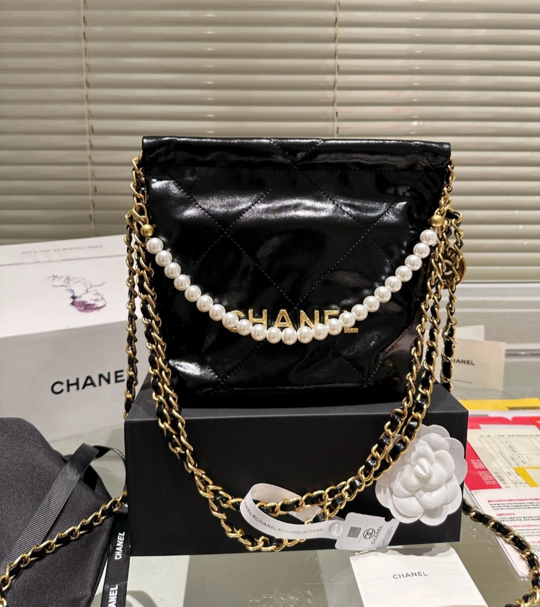Chanel 22 Drawstring pearl chain crossbody bag