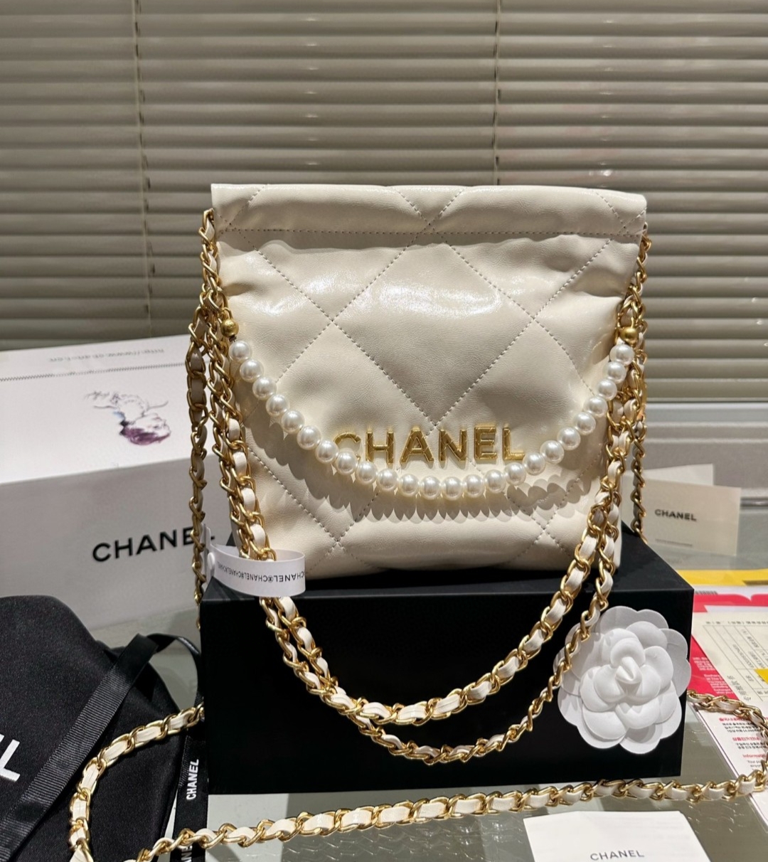 Chanel 22 Drawstring pearl chain crossbody bag